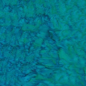 May include: A fabric swatch featuring a marbled pattern in shades of teal, turquoise, and deep blue. The surface displays a fluid, organic design with blended color transitions that create a soft, layered appearance across the entire textile material.