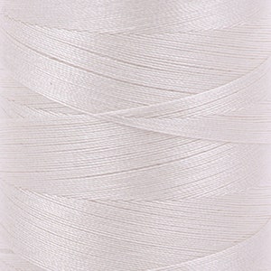 May include: A spool of white thread.