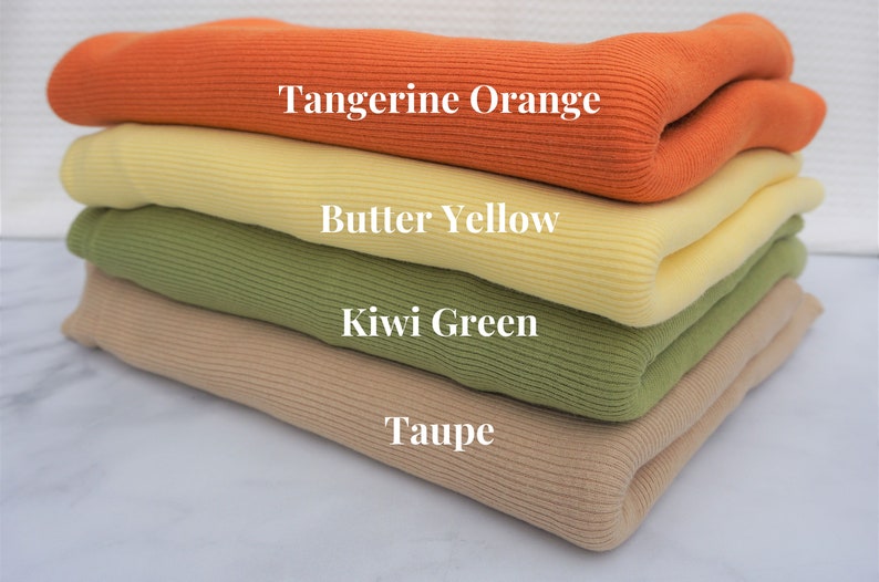May include: A stack of folded ribbed knit fabric in various colors: tangerine orange, butter yellow, kiwi green, and taupe. The names of the colors are displayed in white text on each layer of fabric.