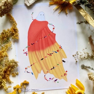 May include: A white ghost wearing a red and yellow candy corn costume with colorful sprinkles. The ghost is surrounded by a white background.