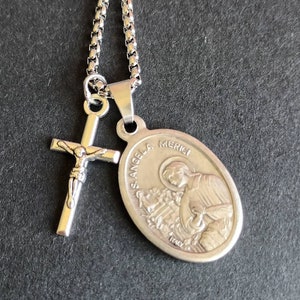 St Angela Merici. Stainless steel box chain with saint medal and crucifix.