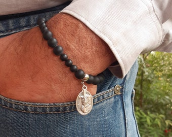 Rosary bracelet.  Matte black onyx with choice of Catholic saint and crucifix. (Male saints- Part 1)