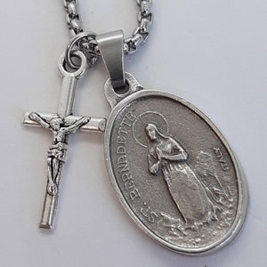 St Bernadette necklace. Stainless steel box chain with saint medal and crucifix.