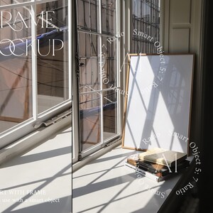 May include: A white frame mockup with a white background, sitting on a windowsill with a stack of books below. The frame is a smart object, making it easy to add your own design.