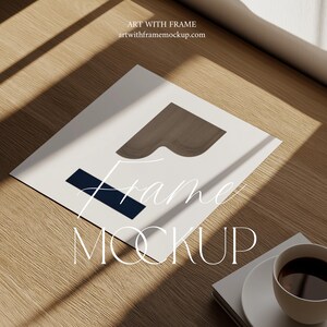 May include: A white frame mockup with a brown wood frame and a blue rectangle on a wooden surface. The text "Frame Mockup" is written below the frame.