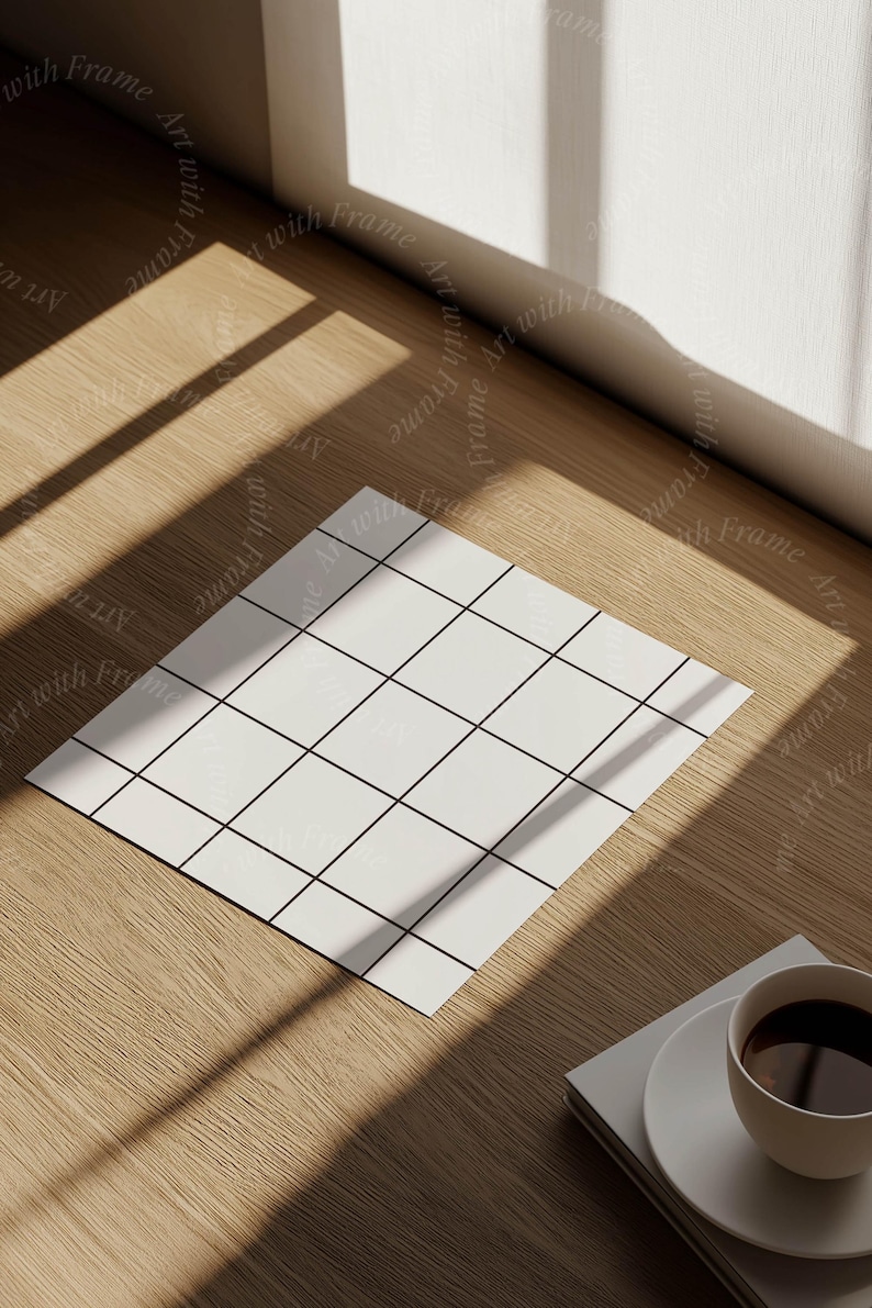 May include: A white gridded paper mockup on a wooden surface with a cup of coffee and a stack of books. The paper is in the center of the image and the coffee cup is in the lower right corner.