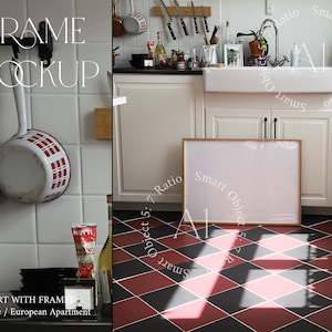 May include: A white framed picture mockup in a kitchen setting. The frame is on a black and red checkered floor. The kitchen has white cabinets and a white porcelain sink. The text "Smart Object 5:7 Ratio" is written on the image.