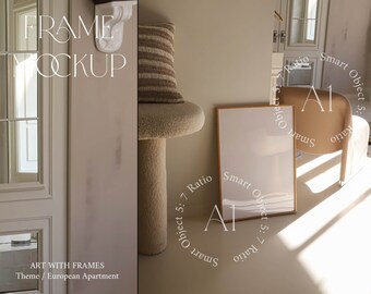 May include: A beige wall with a white frame mockup hanging on it. The frame is empty and has a wooden frame. The wall is also decorated with a fluffy white stool and a brown and white striped pillow. The text "FRAME MOCKUP" is written in white on the wall. The text "ART WITH FRAMES" is written in white on the wall. The text "Theme / European Apartment" is written in white on the wall.