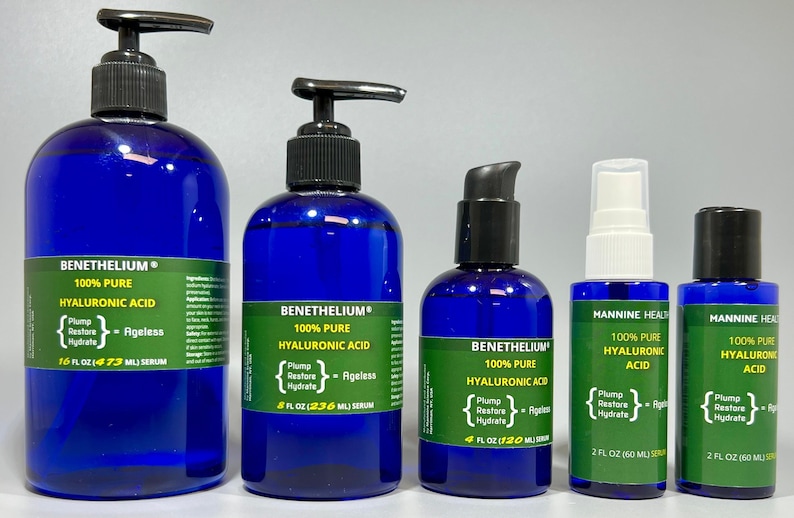 May include: Five bottles of hyaluronic acid serum in various sizes. The bottles are all blue with white labels and black pump tops. The labels say "100% Pure Hyaluronic Acid" and "Plump Restore Hydrate - Ageless". The bottles are arranged in a row from largest to smallest.