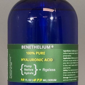 May include: A blue bottle of 100% pure hyaluronic acid serum with a pump dispenser. The label reads "BENETHELIUM&reg; 100% PURE HYALURONIC ACID {Plump Restore Hydrate} = Ageless 16 FL OZ (473 ML) SERUM".