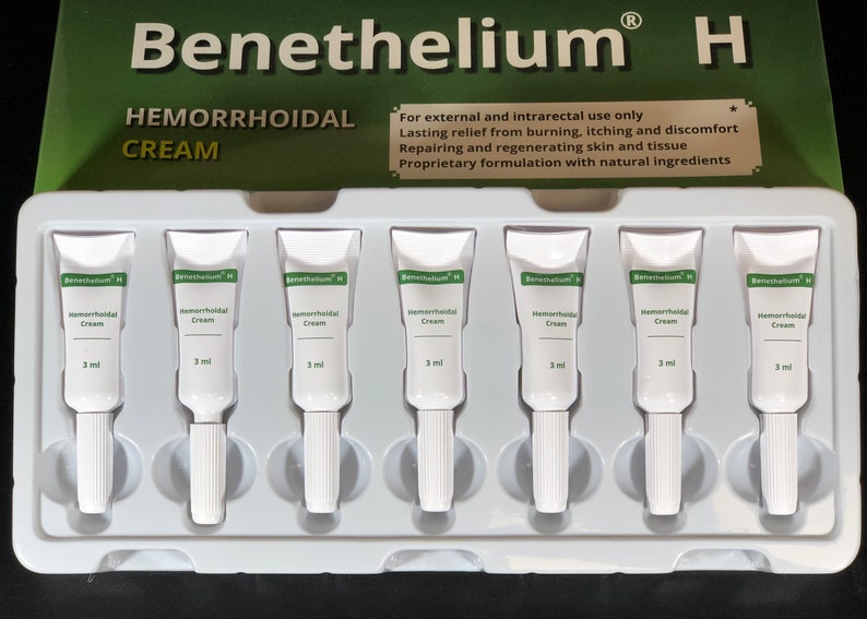 May include: A white plastic tray containing eight individual tubes of hemorrhoidal cream labeled "Benethelium H Hemorrhoidal Cream 3 ml".