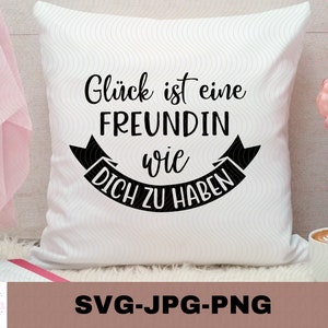 May include: White square pillow with the German text "Glück ist eine Freundin wie Dich zu haben" in black script. The pillow has a wavy pattern and is decorated with a black banner. The bottom of the image has the text "SVG-JPG-PNG".