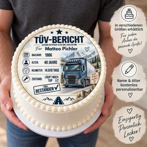 May include: A round cake with a white frosting border featuring a printed edible topper. The design includes a blue semi-truck, mountain landscape, and German text reading TÜV-BERICHT, Matteo Pichler, Baujahr 1986, Alter 40 Jahre, Kilometer 14.610 Tage, Zustand Läuft noch top, and TÜV-Bestanden.