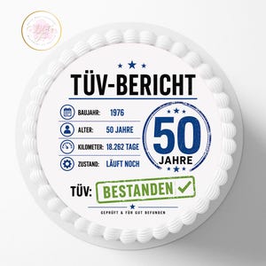 May include: A round cake topper featuring a white background with blue and black text. It displays the German text T&Uuml;V-BERICHT, 1976, 50 JAHRE, 18.262 TAGE, L&Auml;UFT NOCH, and BESTANDEN with a green checkmark. The design includes icons for a calendar, person, speedometer, and gear.