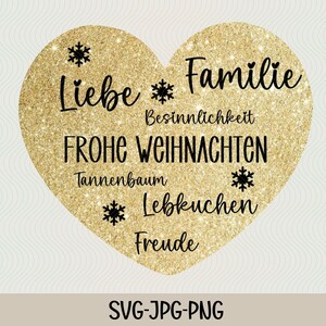 May include: A gold glitter heart with the text "Liebe Familie" and other German words related to Christmas, including "Besinnlichkeit", "Frohe Weihnachten", "Tannenbaum", "Lebkuchen", and "Freude".