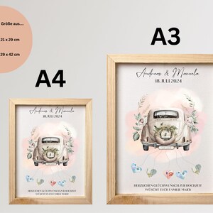 May include: Two framed prints, A4 (21 x 29 cm) and A3 (29 x 42 cm) sizes, with light wood frames. The artwork shows a vintage car decorated with flowers, names "Andreas & Manuela" and the date "18. JULI 2024".