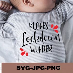 May include: A gray and white striped baby onesie with the text "kleines Lockdown Wunder" in black with red hearts.