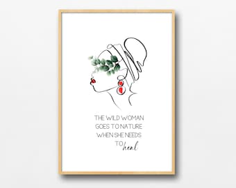 Könnte beinhalten: Ein gerahmter Kunstdruck mit einer minimalistischen Strichzeichnung eines Frauenprofils. Das Auge der Frau ist mit grünen Blättern bedeckt, und sie trägt rote Ohrringe. Der Text lautet: "THE WILD WOMAN GOES TO NATURE WHEN SHE NEEDS TO heal."