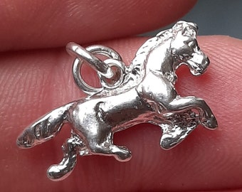 A silver horse pendant charm