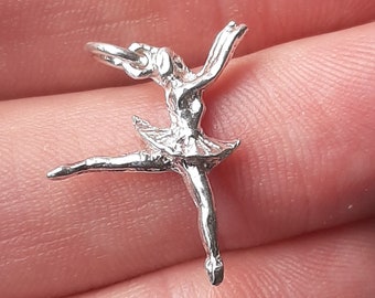 A silver ballerina pendant charm