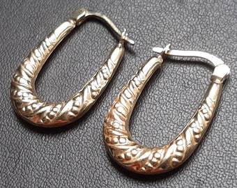 A vintage pair of 9ct gold hoop earrings