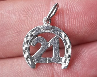 A silver 21st Birthday lucky horseshoe pendant charm