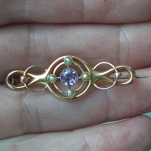 An Antique Edwardian 9ct gold amethyst, and seed pearl brooch