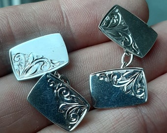 A vintage pair of silver cuff links