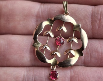 An Antique Art Nouveau 9ct gold red glass pendant