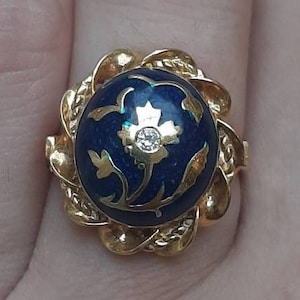 A vintage 14ct gold diamond and blue enamel ring