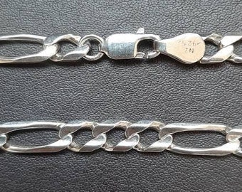 A vintage 20 inch solid silver heavy figaro chain