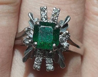 A vintage 18ct white gold emerald and diamond ring