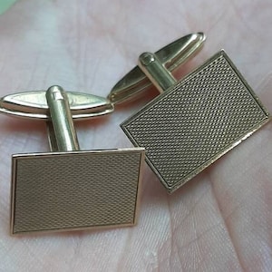 A vintage pair of 9ct gold cuff-links