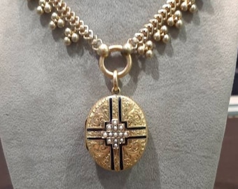 An antique Victorian 15ct gold seed pearl and enamel locket, on an antique Victorian 15ct gold collar chain