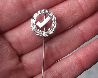 A vintage silver suffragette tie pin