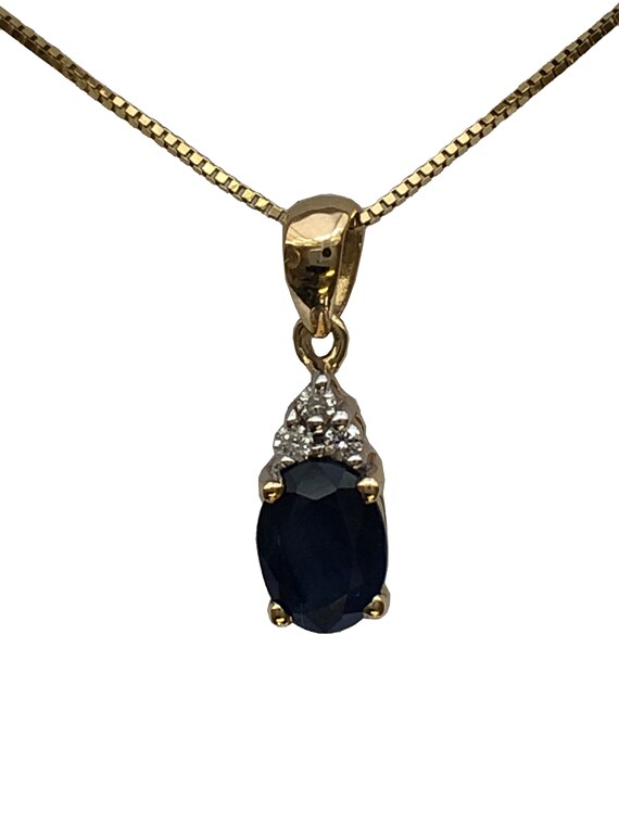 A 9ct gold sapphire and diamond pendant - image 10