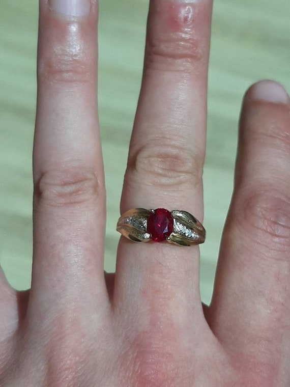 A 9ct gold ruby and diamond ring - image 1