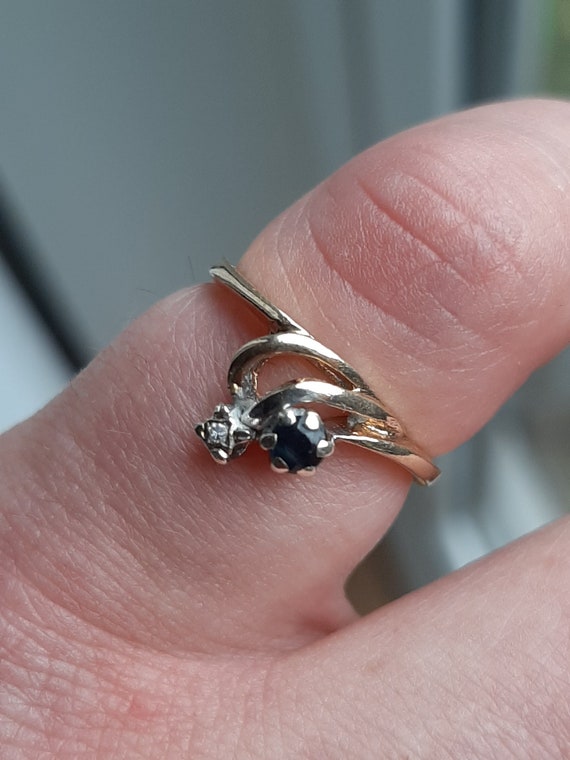 A vintage 9ct gold sapphire and diamond ring - image 1