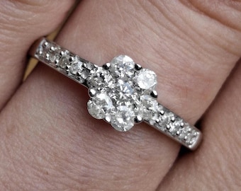 A vintage 9ct white gold diamond cluster ring