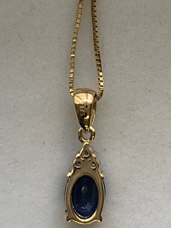 A 9ct gold sapphire and diamond pendant - image 8
