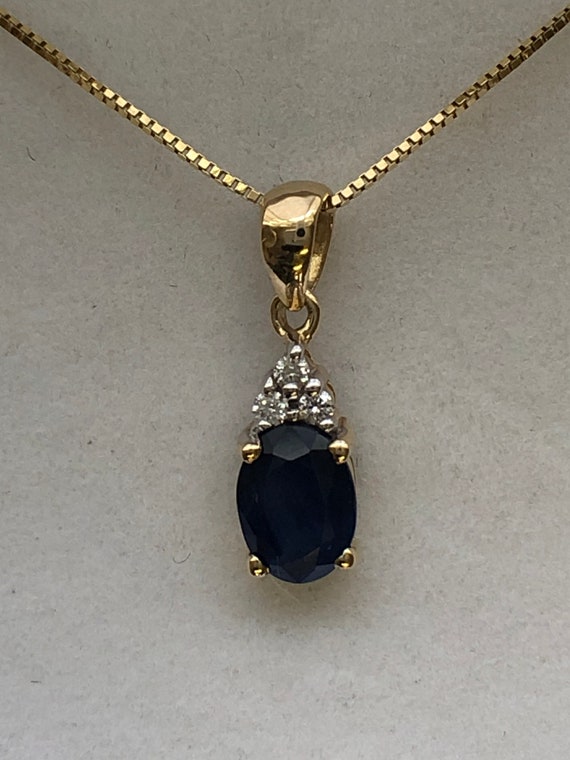 A 9ct gold sapphire and diamond pendant - image 5