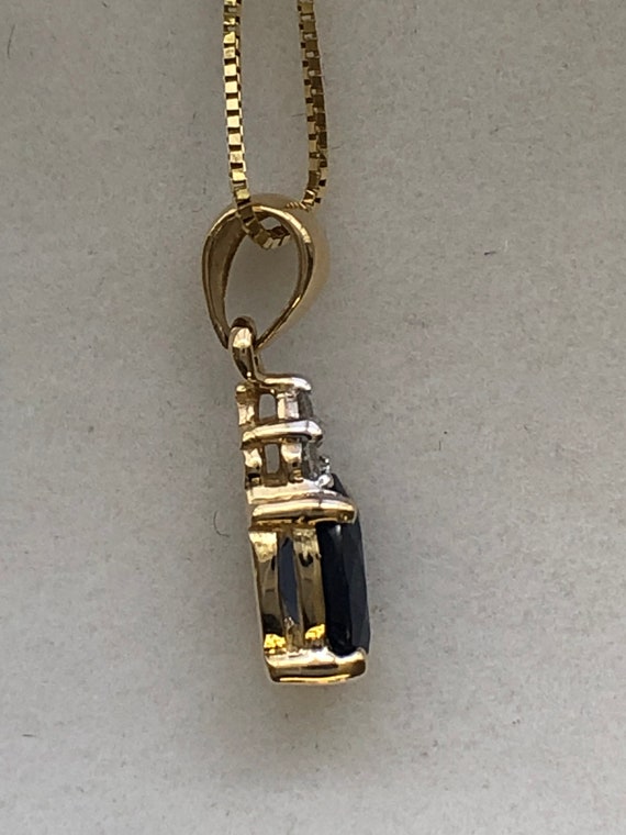 A 9ct gold sapphire and diamond pendant - image 7