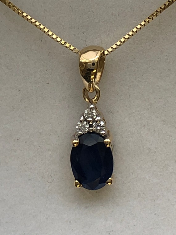 A 9ct gold sapphire and diamond pendant - image 3