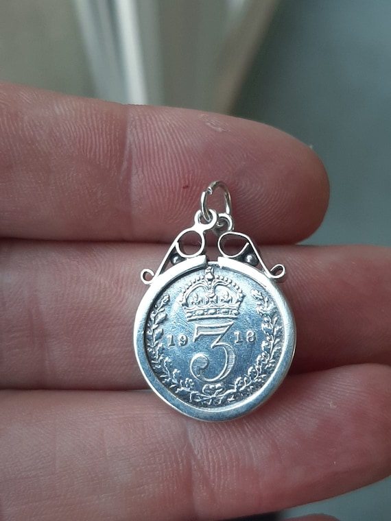 An antique 1918 silver Three pence piece pendant c