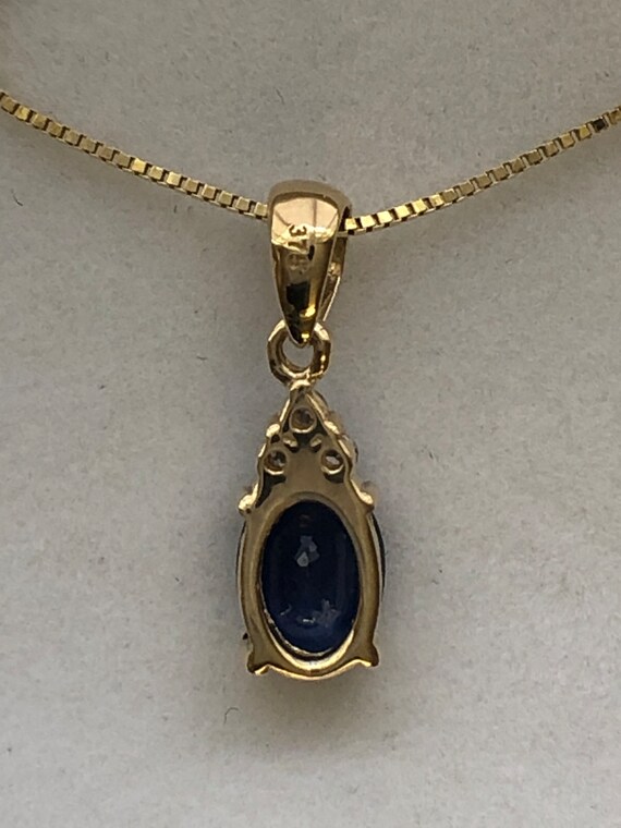 A 9ct gold sapphire and diamond pendant - image 4