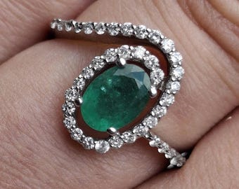 A vintage 18ct white gold emerald and diamond ring