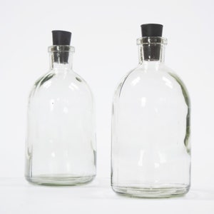 Vintage Apothekerflaschen aus Glas mit schwarzen Stopfen - 2er Set
