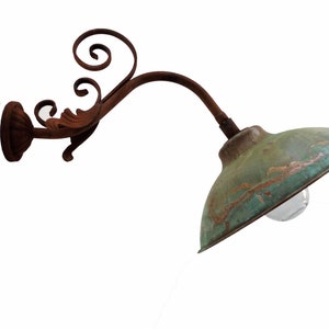 French Barn lamp with copper shade and wrought iron decoration.