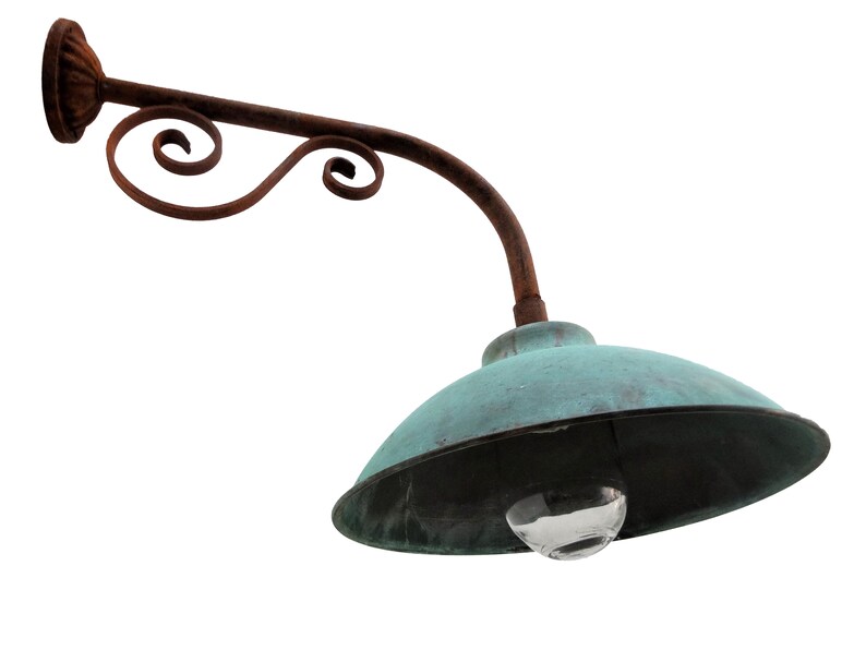 May include: A vintage, rusty metal outdoor light fixture with a teal green, dome-shaped shade and a clear glass globe.