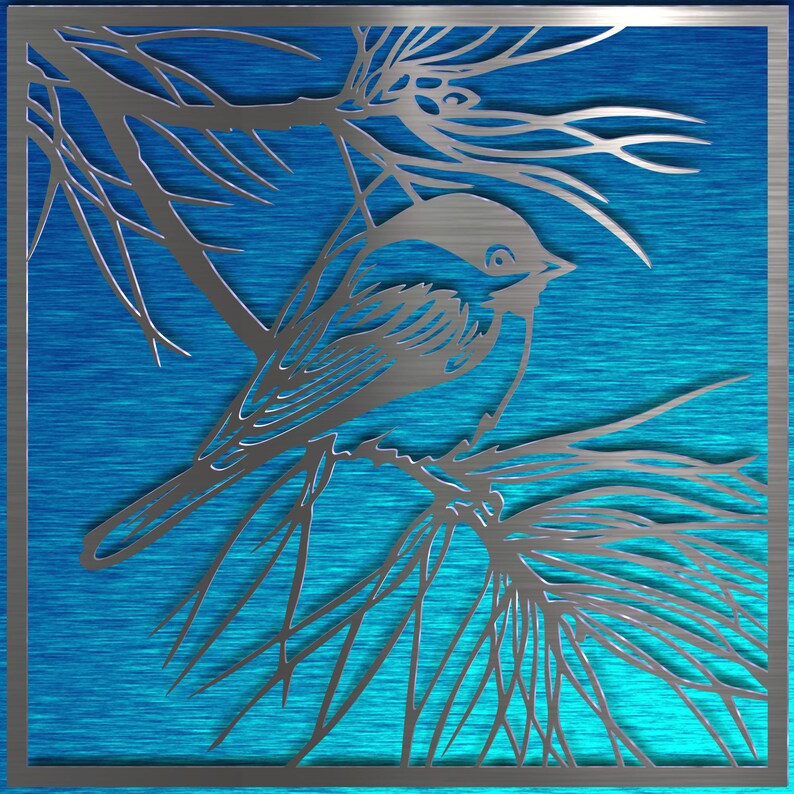 May include: A silver metal wall art piece featuring a bird perched on a branch, set against a blue background. The bird and branches are cut out of the metal, creating a detailed silhouette. The artwork is framed with a silver border.